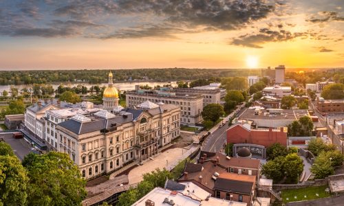 Aerial panorama of Trenton New Jersey skyline and state capitol at sunset. Trenton is the capital city of the U.S. state of New Jersey and the county seat of Mercer County.
